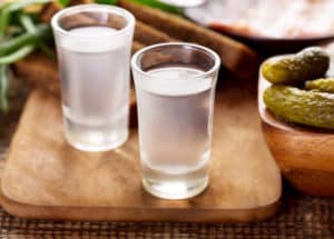 Typical Polish way to drink vodka is with one shot followed by a bite of pickled cucumber to wash it down
