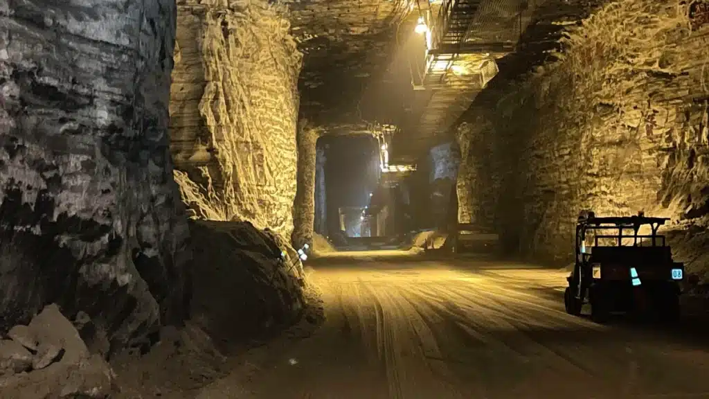 Sifto Salt Mine - a spacious tunnel featuirng an elevated path and mining machinery.