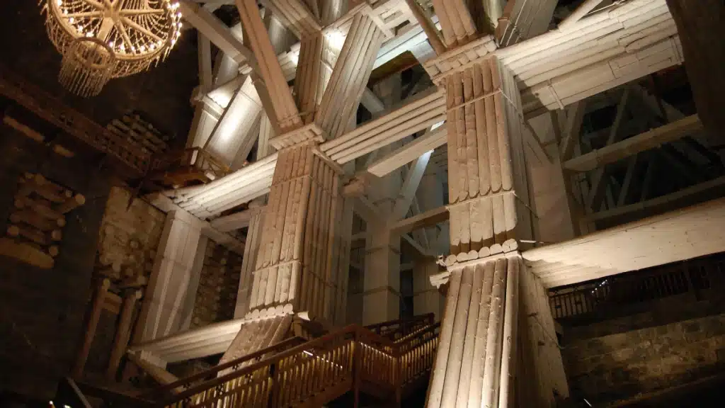 Wieliczka is the most famous salt mine in Poland and features massive wooden pillars supporting its depths.
